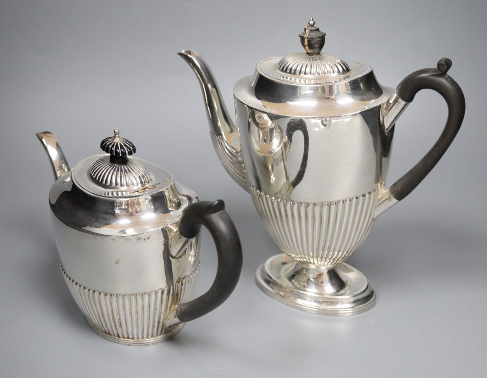 An Edwardian four piece demi-fluted oval silver tea and coffee set, Mappin & Webb, Sheffield, 1902, gross 38oz.